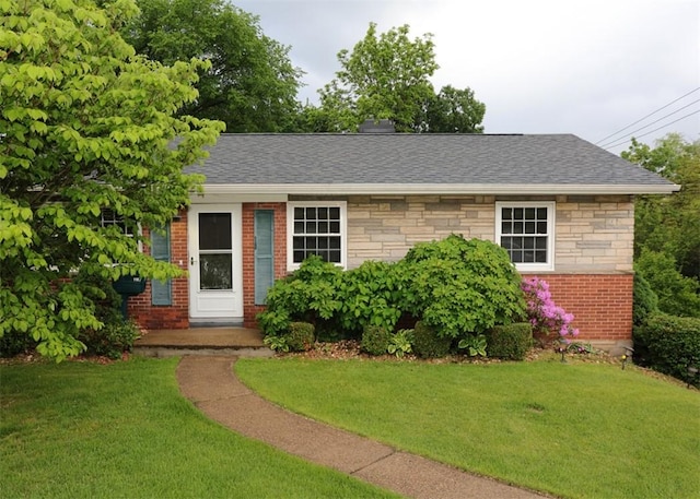 1107 Croxall Ave, Hopewell Twp Bea, PA 15001 - view of front facade with a front lawn, brick siding, roof with shingles, and stone siding