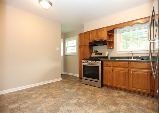 1107 Croxall Ave, Hopewell Twp Bea, PA 15001 - kitchen featuring appliances with stainless steel finishes, under cabinet range hood, a sink, stone finish floors, and brown cabinetry