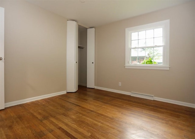 1107 Croxall Ave, Hopewell Twp Bea, PA 15001 - unfurnished bedroom featuring wood finished floors, baseboards, and baseboard heating