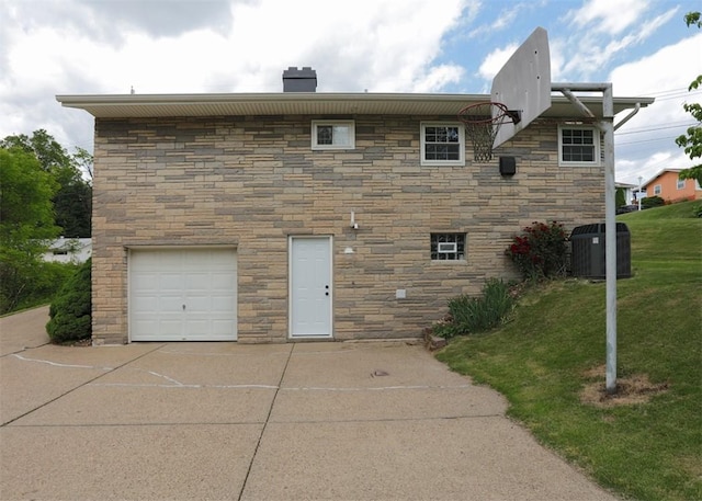 1107 Croxall Ave, Hopewell Twp Bea, PA 15001 - back of house with stone siding, a chimney, central air condition unit, and driveway
