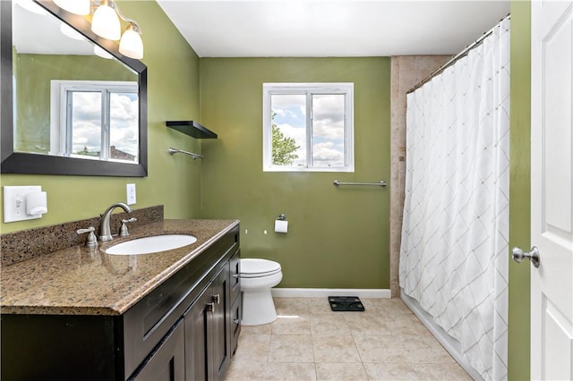 225 Larson Blvd, Rostraver, PA 15012 - full bathroom featuring vanity, toilet, tile patterned flooring, baseboards, and curtained shower