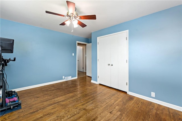 225 Larson Blvd, Rostraver, PA 15012 - unfurnished bedroom with baseboards, wood finished floors, a closet, and a ceiling fan
