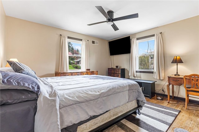 1900 Ardmore Blvd, Forest Hills Boro, PA 15221 - bedroom with multiple windows, wood finished floors, and a ceiling fan