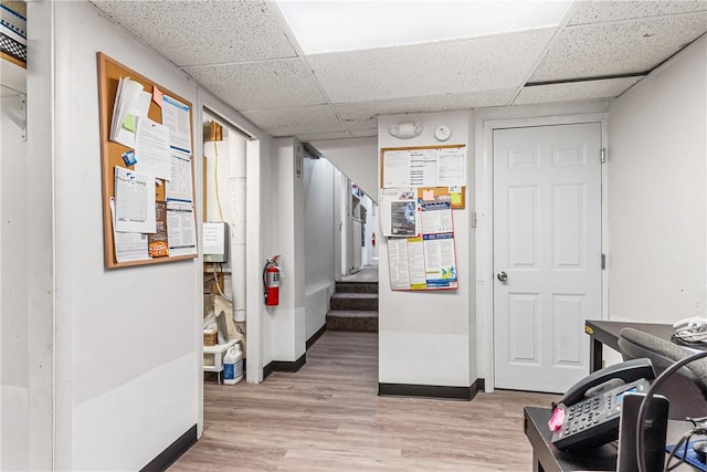 1900 Ardmore Blvd, Forest Hills Boro, PA 15221 - hallway featuring a drop ceiling, light wood-style flooring, baseboards, and stairs