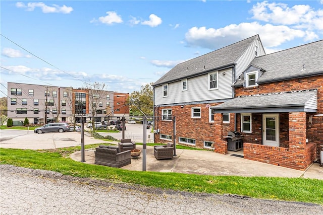 1900 Ardmore Blvd, Forest Hills Boro, PA 15221 - rear view of house with a patio, an outdoor hangout area, and brick siding
