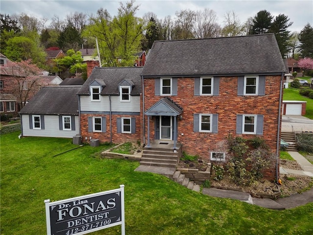 1900 Ardmore Blvd, Forest Hills Boro, PA 15221 - view of front of property featuring cooling unit, a front yard, and brick siding