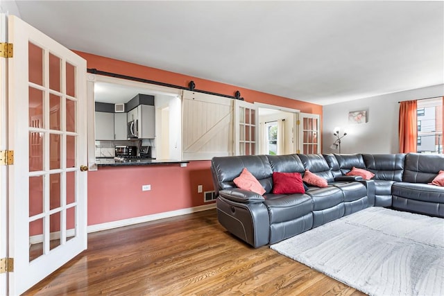 1900 Ardmore Blvd, Forest Hills Boro, PA 15221 - living area with a barn door and wood finished floors