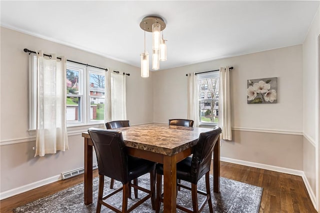 1900 Ardmore Blvd, Forest Hills Boro, PA 15221 - dining room with healthy amount of natural light, baseboards, and dark wood-style flooring