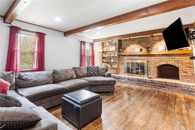 1900 Ardmore Blvd, Forest Hills Boro, PA 15221 - living area with wood finished floors, beam ceiling, a fireplace, and healthy amount of natural light