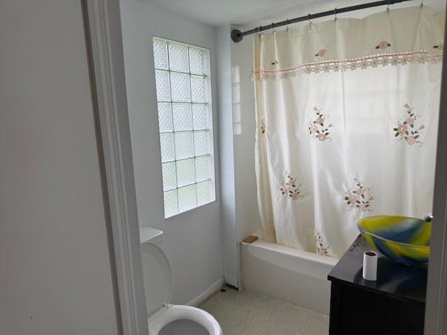 15 Miner Ave, Bentleyville, PA 15314 - bathroom featuring healthy amount of natural light, toilet, vanity, and shower / tub combo