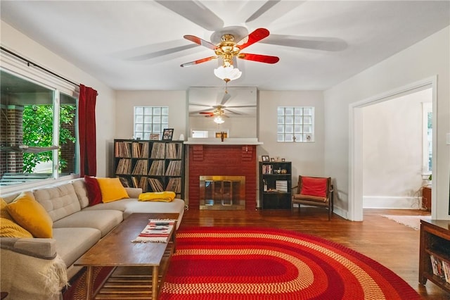 404 Lenox Ave, Forest Hills Boro, PA 15221 - living room with a ceiling fan, wood finished floors, a brick fireplace, and baseboards