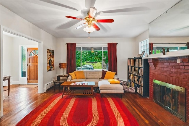 404 Lenox Ave, Forest Hills Boro, PA 15221 - living area featuring wood finished floors, healthy amount of natural light, a ceiling fan, and a fireplace