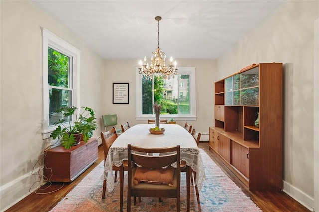 404 Lenox Ave, Forest Hills Boro, PA 15221 - dining area featuring healthy amount of natural light, a chandelier, and dark wood-style flooring
