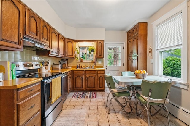 404 Lenox Ave, Forest Hills Boro, PA 15221 - kitchen featuring under cabinet range hood, electric stove, plenty of natural light, and brown cabinets