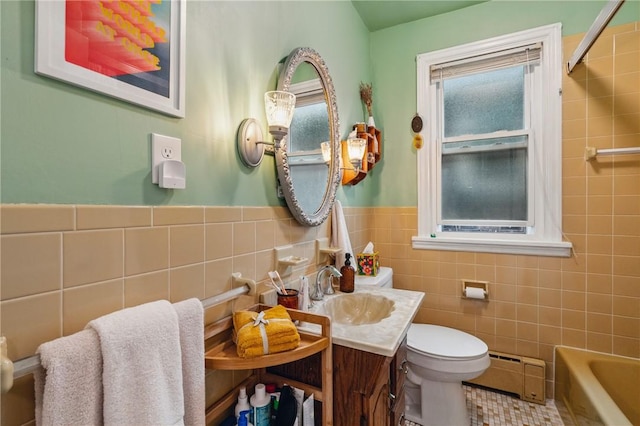 404 Lenox Ave, Forest Hills Boro, PA 15221 - bathroom with baseboard heating, tile walls, a tub, toilet, and vanity