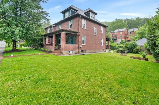 404 Lenox Ave, Forest Hills Boro, PA 15221 - rear view of property with brick siding and a yard