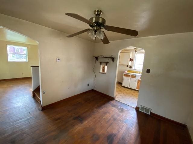923 7th Ave, Elizabeth Twp/Boro, PA 15037 - unfurnished room featuring a ceiling fan, arched walkways, dark wood-style flooring, and baseboards