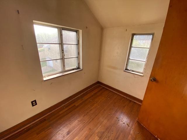 923 7th Ave, Elizabeth Twp/Boro, PA 15037 - spare room with vaulted ceiling, wood-type flooring, and baseboards