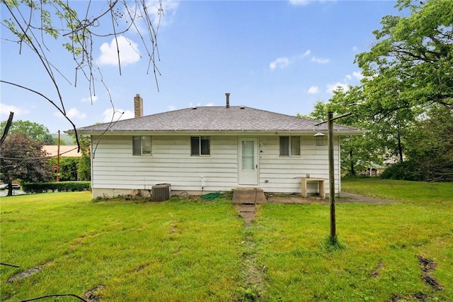 233 6th St, California, PA 15419 - back of house featuring a lawn, a chimney, and central AC