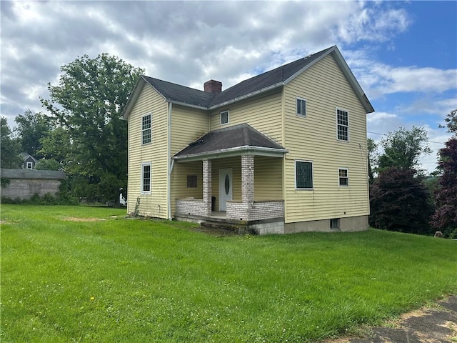 112 Laughlin St, Dawson, PA 15428 - view of front of home with a chimney, a front lawn, and a porch