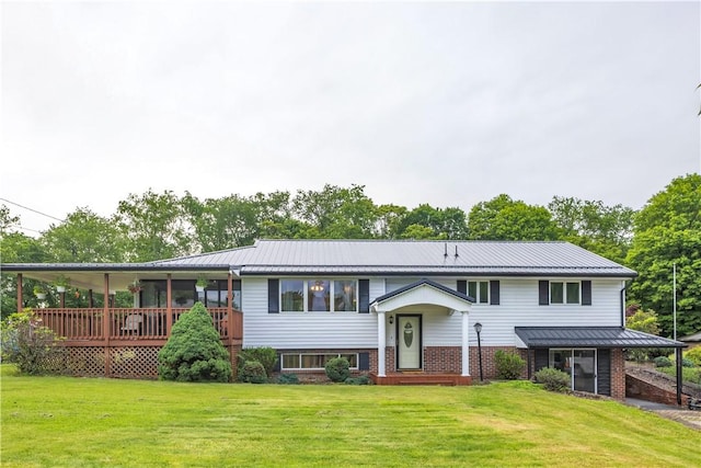 536 Hopewell Rd, Luzerne Twp, PA 15433 - rear view of house featuring a yard, metal roof, brick siding, and a standing seam roof
