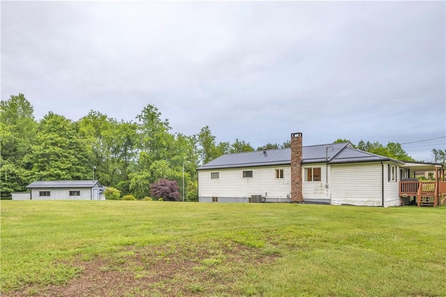 536 Hopewell Rd, Luzerne Twp, PA 15433 - rear view of house with a yard, a chimney, metal roof, and central AC unit