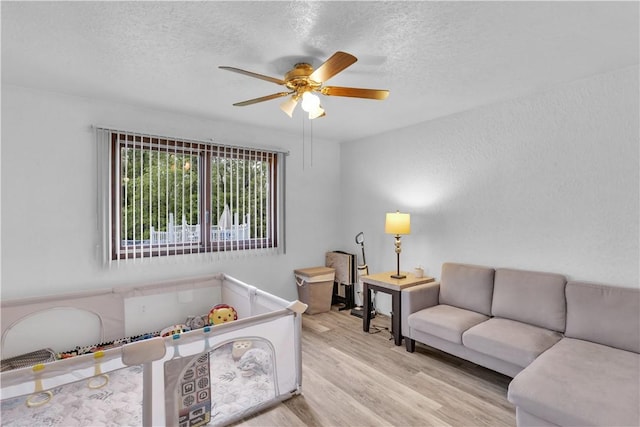 536 Hopewell Rd, Luzerne Twp, PA 15433 - bedroom featuring a textured ceiling, wood finished floors, and a ceiling fan