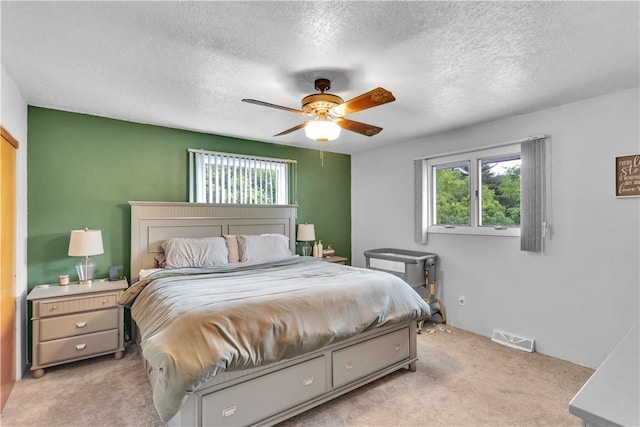 536 Hopewell Rd, Luzerne Twp, PA 15433 - bedroom with light colored carpet, a textured ceiling, and ceiling fan