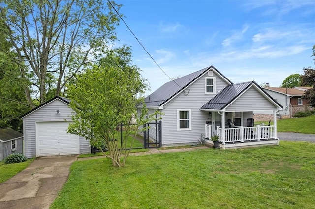 190 Elm St, Daugherty Twp, PA 15066 - back of house featuring a porch, driveway, a lawn, a garage, and metal roof