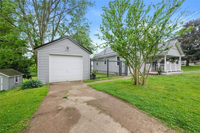 190 Elm St, Daugherty Twp, PA 15066 - view of front of home featuring an outdoor structure, concrete driveway, a porch, and a garage