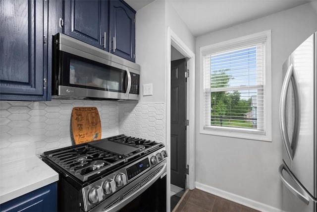 190 Elm St, Daugherty Twp, PA 15066 - kitchen featuring stainless steel appliances, blue cabinets, tasteful backsplash, light countertops, and baseboards