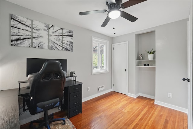 9440 Peebles Rd, Mccandless, PA 15101 - home office featuring wood finished floors, baseboards, and a ceiling fan