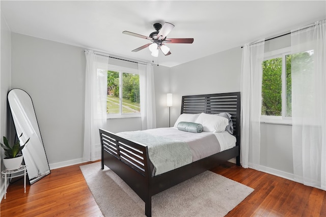 9440 Peebles Rd, Mccandless, PA 15101 - bedroom with wood finished floors, baseboards, and ceiling fan