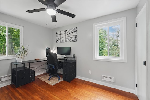 9440 Peebles Rd, Mccandless, PA 15101 - office space featuring wood finished floors, baseboards, a ceiling fan, and a baseboard radiator