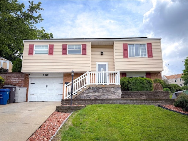 3181 Mellott Rd, Baldwin Boro, PA 15227 - split foyer home with a front yard, driveway, an attached garage, and brick siding