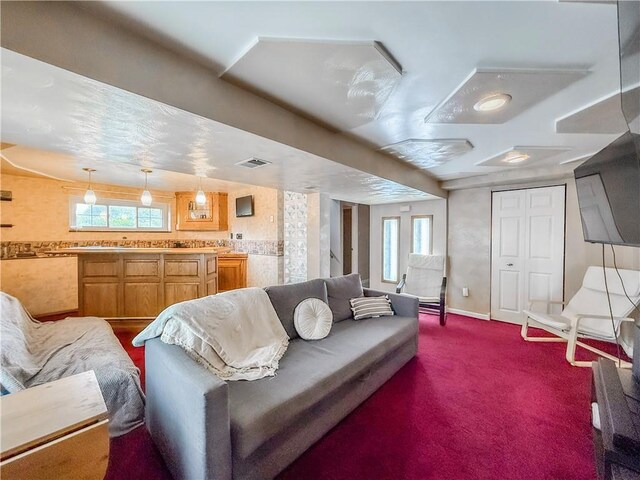 3181 Mellott Rd, Baldwin Boro, PA 15227 - living area with plenty of natural light, baseboards, and dark carpet