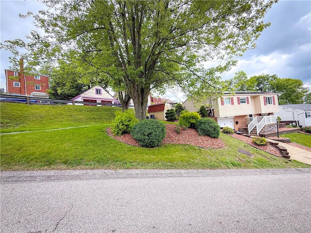 3181 Mellott Rd, Baldwin Boro, PA 15227 - view of front of house featuring a garage and a front lawn