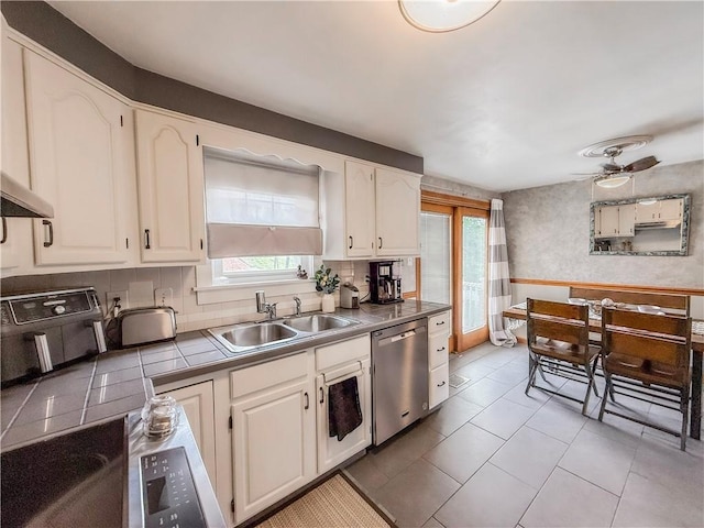 3181 Mellott Rd, Baldwin Boro, PA 15227 - kitchen featuring stainless steel dishwasher, a sink, white cabinetry, and tasteful backsplash