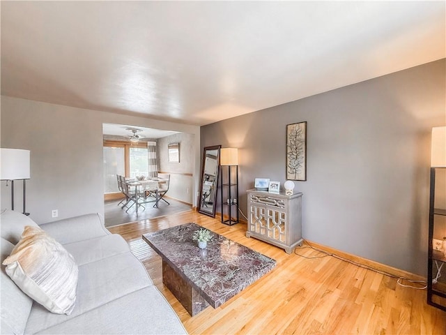 3181 Mellott Rd, Baldwin Boro, PA 15227 - living room featuring wood finished floors, ceiling fan, and baseboards