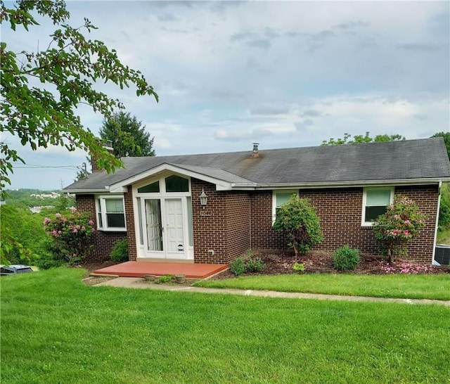 1046 Elicker Rd, Plum Boro, PA 15068 - view of front of house featuring brick siding, a front lawn, and a shingled roof