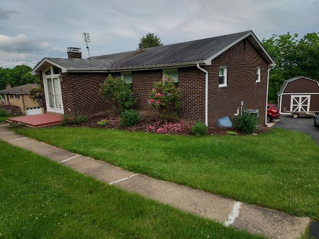 1046 Elicker Rd, Plum Boro, PA 15068 - view of side of property featuring a chimney, brick siding, and a lawn