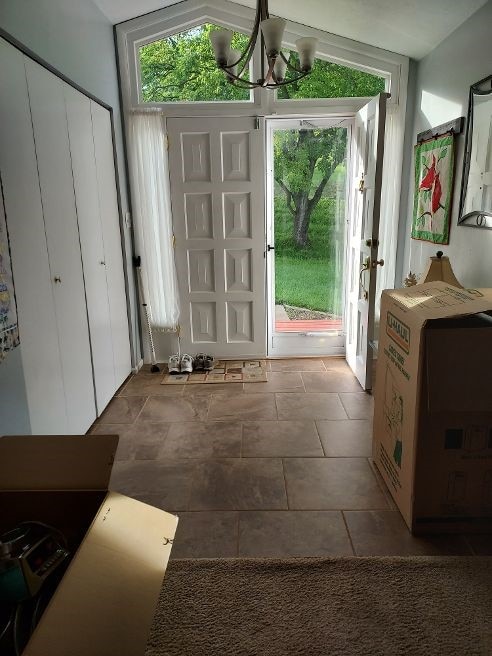 1046 Elicker Rd, Plum Boro, PA 15068 - entryway featuring a chandelier and tile patterned flooring