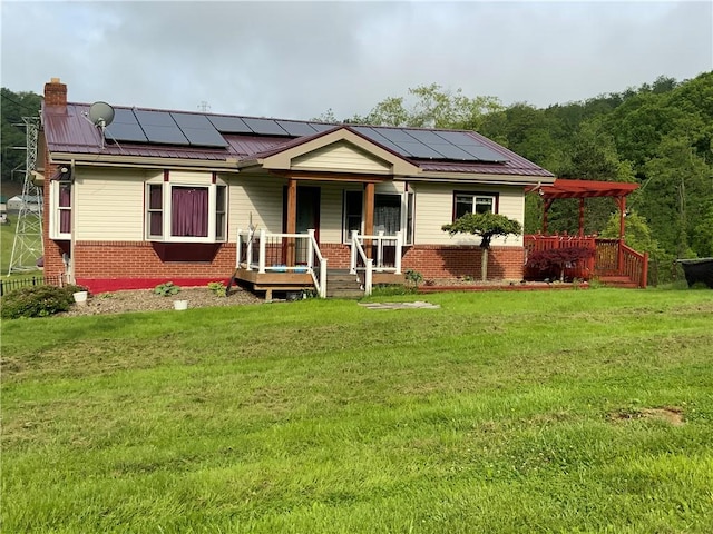 600 Moore Rd, South Franklin, PA 15301 - view of front of house with a porch, brick siding, solar panels, and a front yard