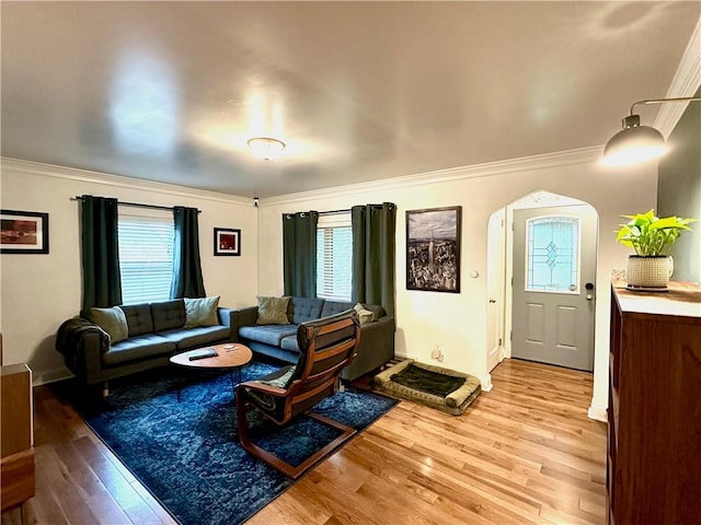 3301 Hazelhurst Ave, Baldwin Boro, PA 15227 - living room featuring light wood-style flooring, arched walkways, ornamental molding, and baseboards