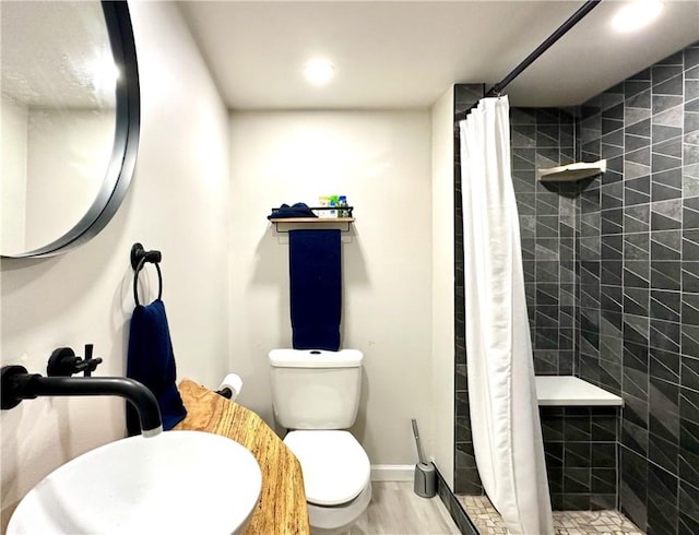 3301 Hazelhurst Ave, Baldwin Boro, PA 15227 - bathroom featuring a sink, a stall shower, toilet, recessed lighting, and baseboards