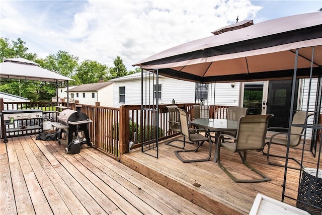 229 Holyoke Rd, Center Twp But, PA 16001 - wooden deck featuring a gazebo, outdoor dining area, and a grill