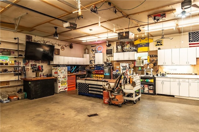 229 Holyoke Rd, Center Twp But, PA 16001 - garage featuring a workshop area and a garage door opener