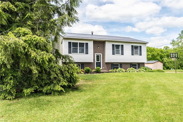 229 Holyoke Rd, Center Twp But, PA 16001 - raised ranch featuring a front lawn, brick siding, and metal roof