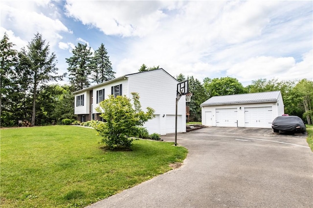 229 Holyoke Rd, Center Twp But, PA 16001 - view of side of property featuring a yard, an outdoor structure, and a detached garage
