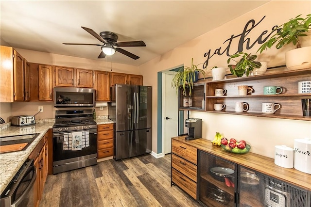 229 Holyoke Rd, Center Twp But, PA 16001 - kitchen featuring stainless steel appliances, a ceiling fan, brown cabinetry, dark wood-type flooring, and a sink
